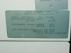 Queue Systems QU2195D12 rating plate showing model number, electrical specs 208/230V 1PH 16A 60Hz, refrigerant charge QRF0060 61.8 oz, and test pressures 400/200 PSIG