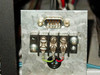 Queue Systems QU2195D12 – detail of rear electrical connection panel showing DB9 serial connector and screw-terminal power block with wiring