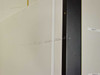 Queue Systems QU2195D12 Cryostar – interior side wall close-up showing surface scratches and scuff marks, with shelf label tabs visible