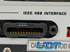 UDT S380 Optometer – close-up of IEEE 488 GPIB interface connector and UDT Instruments calibration void seal sticker on rear panel