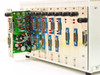 TCL 2110 Multiport Transceiver with leftmost 2110-2BDM card partially ejected showing green PCB populated with ICs, resistors, and capacitors