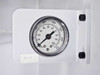 Close-up of in-cabinet pressure gauge labeled PI 3 mounted on white bracket inside FSI ChemFill canister bay