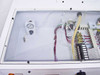 Interior top compartment of FSI ChemFill cabinet showing pressure gauge, solenoid valve, wiring harness, and terminal block assembly
