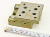 Schneeberger Rondal RF linear slide — angled top view showing tapped mounting holes and olive-green anodized body with tape measure for scale