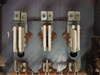 Interior view showing three-pole switch jaw and blade assembly with visible rust and wear on switch mechanism