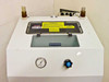 Top panel of Systems Chemistry chemical day tank system showing analog pressure gauge, blue valve knob, top-access hatch with caution labels, and two bulkhead fittings