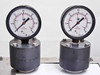 Two United Instruments pressure gauges 0-60 psi / 0-4 bar mounted on stainless steel manifold fittings