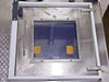 Wafer mask cleaner process chamber top view through transparent lid showing stainless steel frame and yellow wafer/mask holders