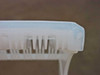 Top edge detail of the A182-60MU wafer cassette showing slot fingers and alignment tabs