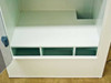Interior lower shelf of Systems Chemistry enclosure with three-compartment storage tray