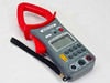 Right-Tech 53341 True RMS Clamp Meter front view showing red jaw clamp, gray body, LCD display, and keypad