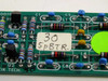 Close-up of Guzik 300100A PCB front component side showing inductors, capacitors, transistors Q1 and Q2, and hand-written label '30 5pBTR'