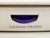 Canon CanoScan FB 630U model name label and USB power button on front edge of scanner