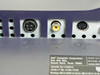Dell 2001FP rear I/O panel close-up — 4-pin DIN power connector, Composite Video RCA jack (yellow), S-Video 4-pin mini-DIN port