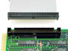 Cubix A2430 interface card closeup showing 60-pin IDC connector and ribbon cable connector aligned — component detail view