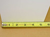 Royal 6-1349 white folding paper box measured against tape measure showing approximately 5.25 inch width