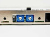Cubix A3970 — close-up of dual blue hex rotary DIP switches (0–F range) and partial RJ port on the rear bracket