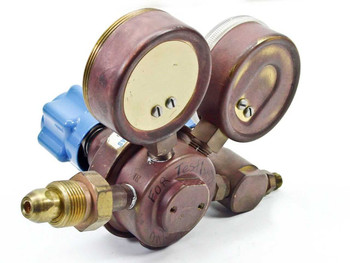 Union Carbide UPD-3-25-580 regulator rear and underside view showing brass fittings and body construction