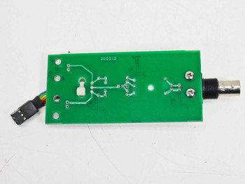 Guzik C201 300210 Calibrator board reverse/solder side showing PCB traces, part number 300210, and ribbon cable connector