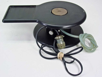 Harris/Farinon 1107 heated wafer chuck — front 3/4 view showing 2.25-inch circular vacuum plate, rectangular tray extension, black body, multi-pin mil-spec connector, and clear pneumatic tubing
