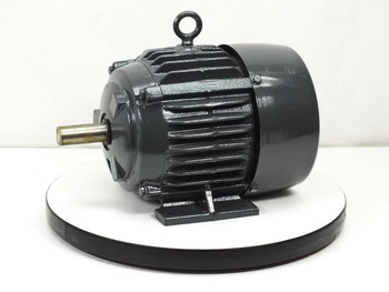 Dayton 4FN65 3HP three-phase motor — left-side and drive-end view showing shaft and cooling fins