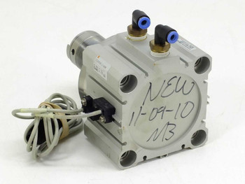 SMC CDQ2KB80-UIA980 pneumatic cylinder – side view showing aluminum body with handwritten label and push-in elbow fittings on top