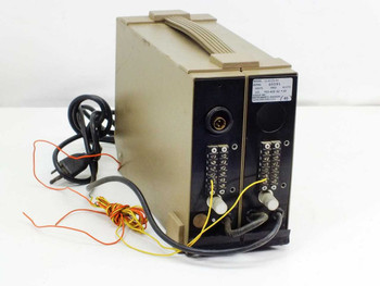 Gould 11-4123-01 DC Amplifier — rear view showing circular power connector, two rows of screw terminals, and attached red, yellow, and orange lead wires with power cable