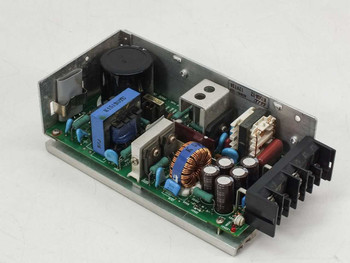 ELCO K150A-12 open frame power supply, angled rear view showing heatsink fins and component side of PCB