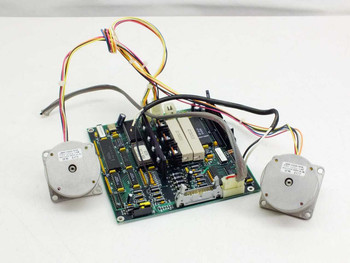 ADIC 17-1076-01 PCB assembly with two stepping motors laid out flat — rear/component-side view showing ICs, relays, and capacitors