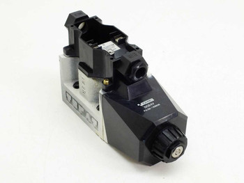 Tokimec 02-123806 D7-24 DC 24V hydraulic solenoid valve — front-left three-quarter view showing solenoid coil housing and valve body