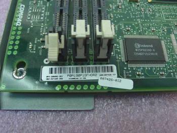 Compaq 296682-001 motherboard PCB rear showing part number label, SIMM slots, and Winbond W25P022AD-6 chip
