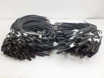 Lot of 100 MC3 male solar panel cables 22 inches long shown coiled on white surface — full lot overview