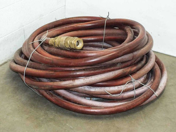 Thermoid Cobra 1-1/4" 250 PSI fuel oil delivery hose – full 159 ft coil with brass fitting visible, red NBR cover
