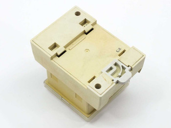 SMC PSE100-B pressure switch rear and bottom view showing DIN rail clip and plastic housing — cream colored enclosure