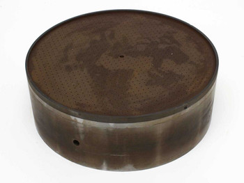 OS Walker AXM-13973-1 20-inch round vacuum chuck — angled top view showing perforated surface face with significant surface rust and side wall with vacuum port hole