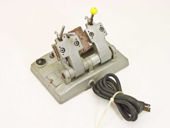 Hollywood Film Company FS-816 16mm hot splicer – left rear three-quarter view showing splicing mechanism and yellow knob