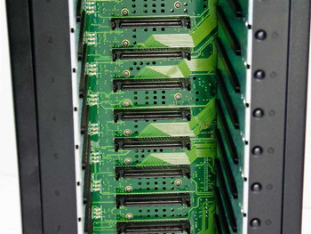 StorCase S10A114 — close-up of internal backplane showing 14 SCA-2 SCSI drive slots with green PCBs and 68-pin connectors