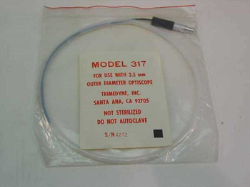 Trimedyne Model 317 fiber optic cable in original sealed plastic bag with manufacturer label showing model, 2.5mm OD Optiscope compatibility, and serial number