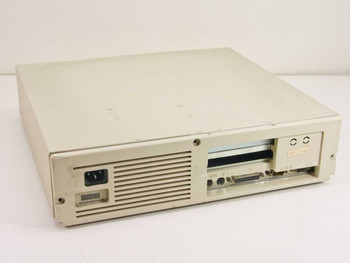 Compaq DeskPro 286n Model 3010 – left side front view showing power inlet, ventilation grille, floppy drive, and rear port cluster