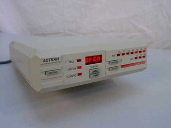 Adtran DSU II AR J131C front panel showing ADTRAN logo, LED display reading OPEN, TEST STATUS CONFIG buttons, SCROLL dial, CANCEL ENTER buttons, and PRI SEC LED status indicators