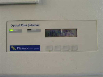 Plasmon 555700-000 Optical Disk Jukebox – close-up of front panel LCD display reading ICE IS EMPTY / DRIVE IS EMPTY with Plasmon Data Systems logo and control buttons