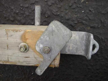 U.S. Poles NM 85 close-up of ridge-female connector bracket hardware at base of pole section