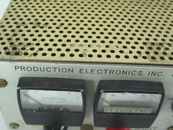 Production Electronics LS-40/5 – close-up of front panel showing Amperes and Volts analog meters with ADJ. 24V marking and brand label