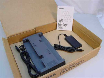 Toshiba PA2508U battery charger in open factory box with PA2440U AC adapter, power cable, and user manual