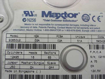 Maxtor 90650U2 label detail showing model, HDA/PCBA revisions, cylinders/heads/sectors, jumper settings, and 12V 5V power specs