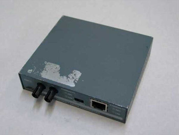 Allied Telesyn AT-MC101 Fast Ethernet Media Converter — front/top angled view showing ST fiber ports and RJ-45 port with paint wear on top