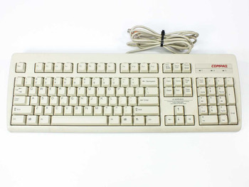 Compaq RT235BTW PS/2 Spacesaver Keyboard 121975-001 — top view showing full key layout and attached PS/2 cable