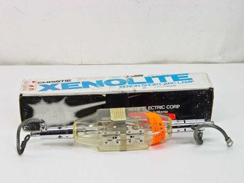Christie Electric Xenolite CXL 3000 xenon short-arc lamp removed from box, shown with original Christie Xenolite packaging in background