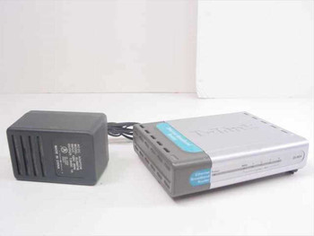D-Link DI-604 broadband router shown from the front-left with silver casing and included black AC adapter alongside