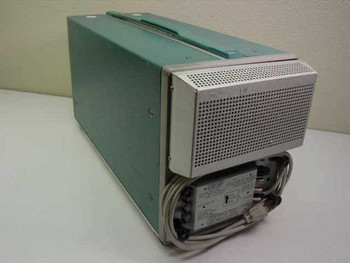 Tektronix 7633 oscilloscope mainframe — rear and right-side view showing ventilation panel and AC power entry with line filter/fuse block and power cord